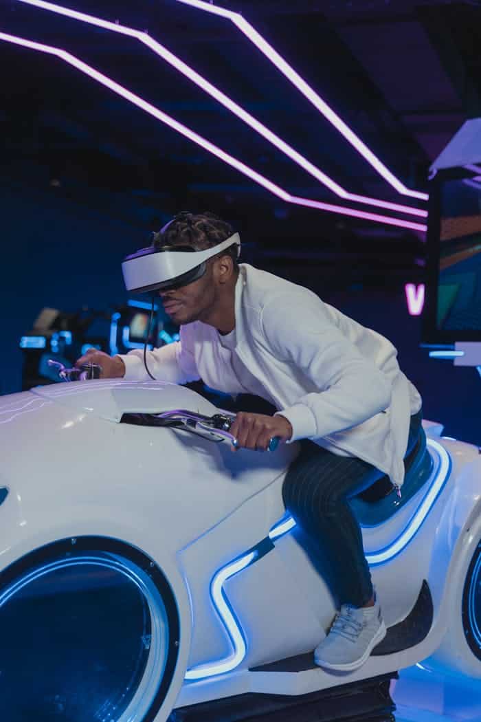 A person engaged in a thrilling virtual reality motorbike simulator experience indoors.